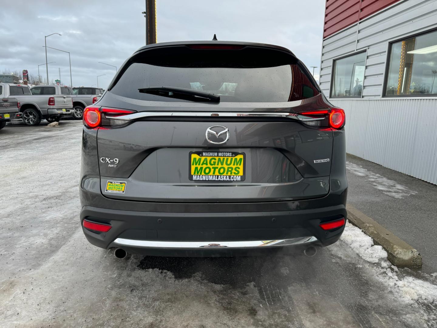 2021 Gray /Black Mazda CX-9 Grand Touring AWD (JM3TCBDY5M0) with an 2.5L L4 DOHC 16V engine, 6A transmission, located at 1960 Industrial Drive, Wasilla, 99654, (907) 274-2277, 61.573475, -149.400146 - Photo#4